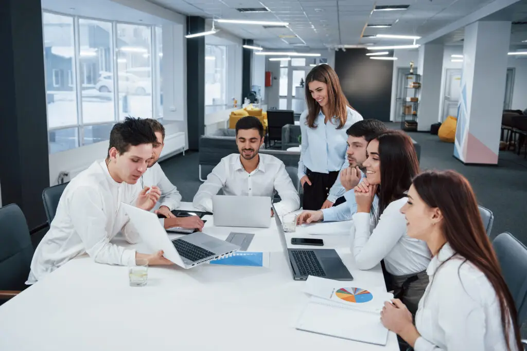 showing good results group young freelancers office have conversation smiling 1